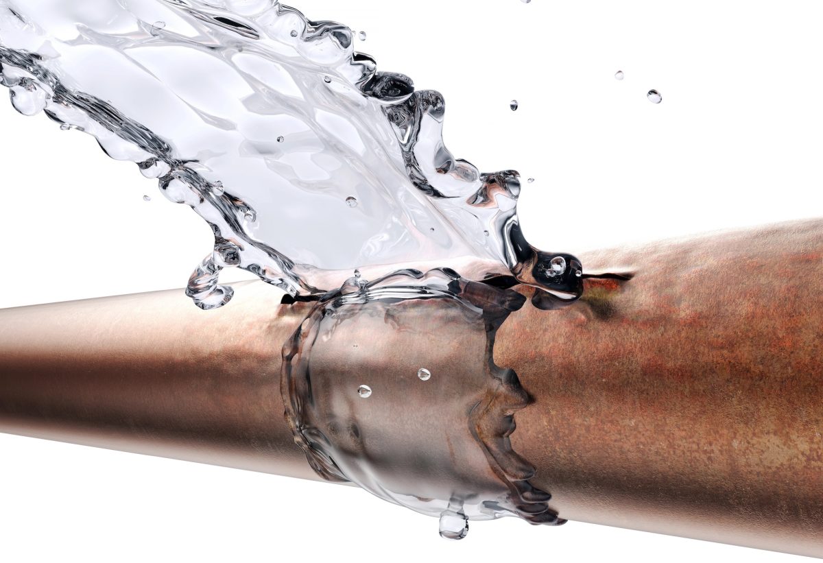 Water spraying from a burst copper pipe