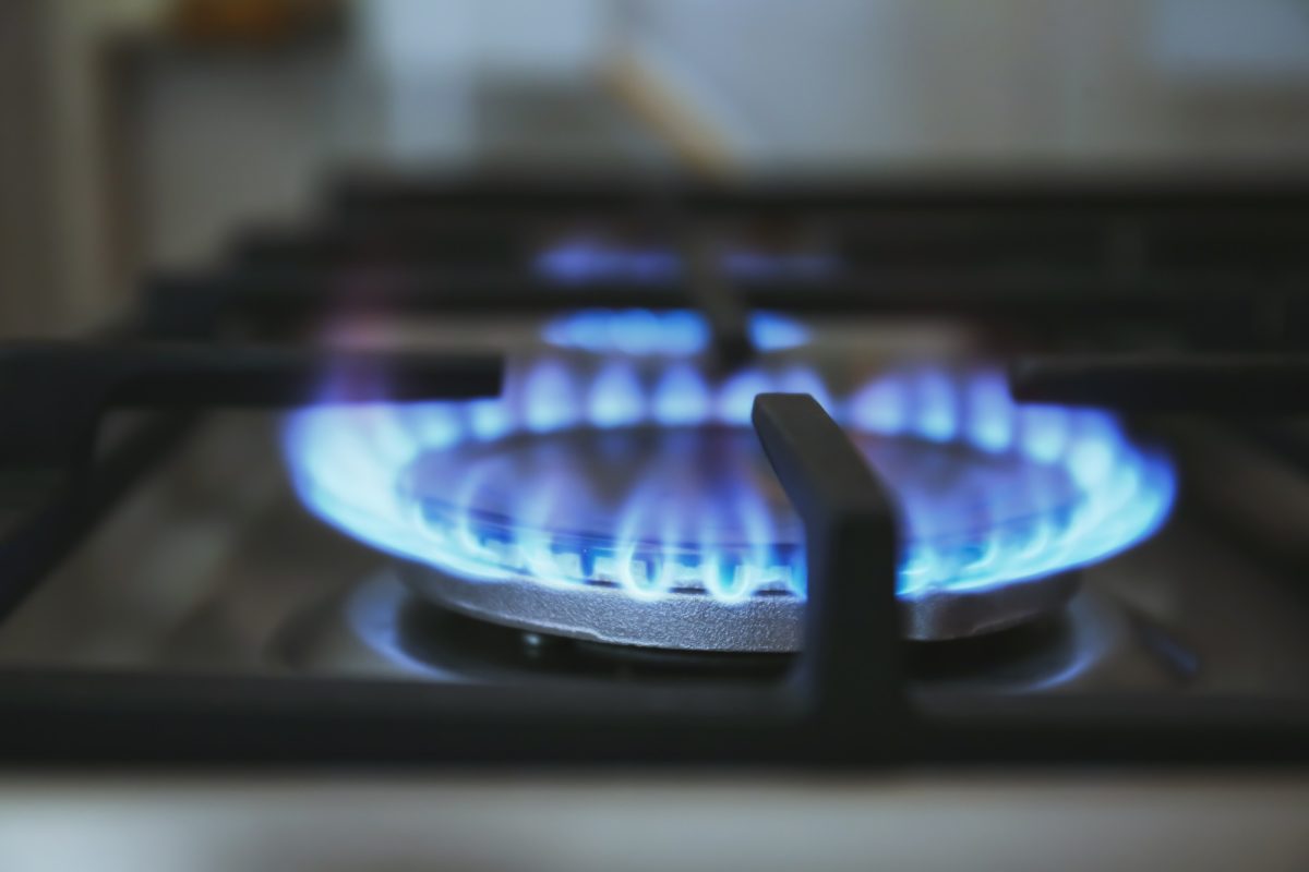Blue flame on a gas cooktop burner