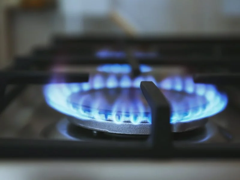Blue flame on a gas cooktop burner